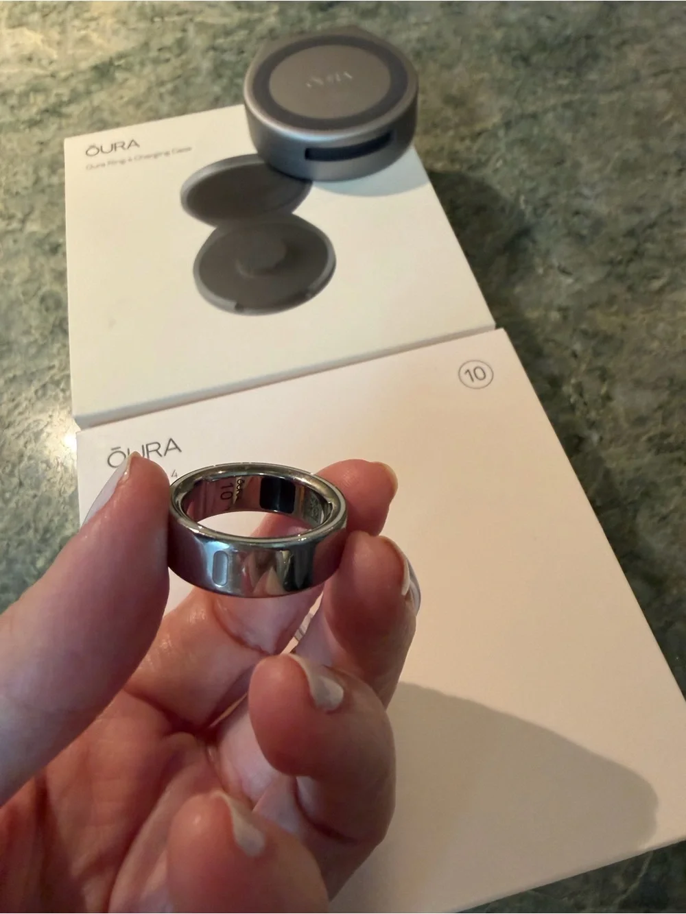 Oura ring 4 size 10 in silver with charging cord PLUS portable charging case.